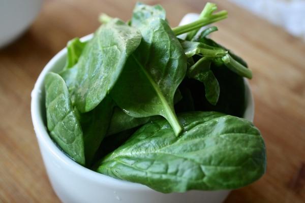 A bowl of spinach leaves