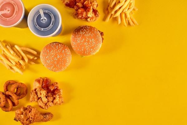 A photo of fast food against a yellow background